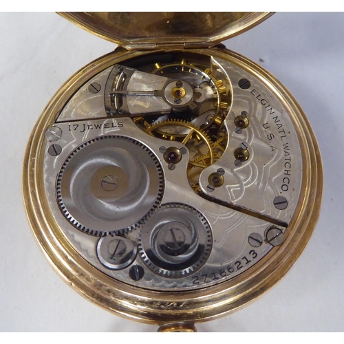 13 - A 9ct gold cased half-hunter pocket watch, the movement faced by a white enamel Roman dial, incorpor... 