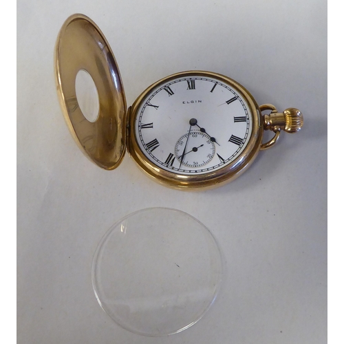 13 - A 9ct gold cased half-hunter pocket watch, the movement faced by a white enamel Roman dial, incorpor... 