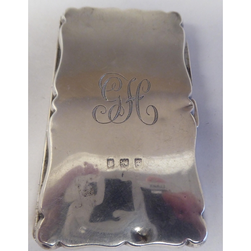 136 - Silver items: to include an Edwardian serpentine outlined, folding notelet case  mixed marks