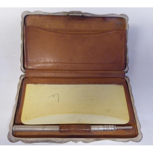 136 - Silver items: to include an Edwardian serpentine outlined, folding notelet case  mixed marks