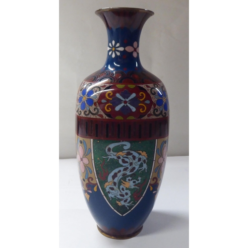 144 - An early 20thC cloisonné shouldered, baluster shape vase, decorated in colours and panels, de... 