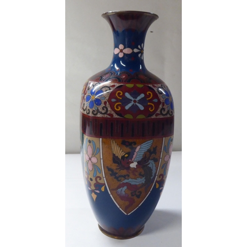 144 - An early 20thC cloisonné shouldered, baluster shape vase, decorated in colours and panels, de... 