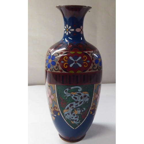 144 - An early 20thC cloisonné shouldered, baluster shape vase, decorated in colours and panels, de... 