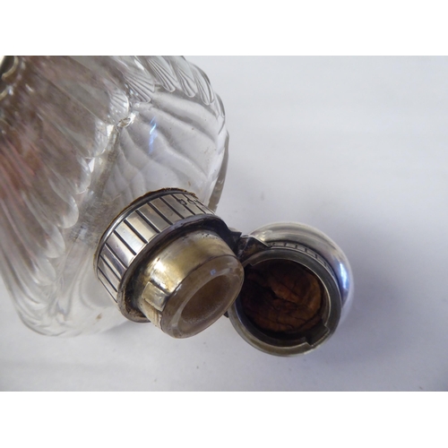 146 - A silver mounted, reed moulded glass hip flask with a detachable sleeve cup and outset hinged cap&nb... 