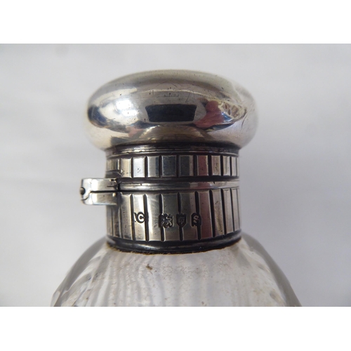 146 - A silver mounted, reed moulded glass hip flask with a detachable sleeve cup and outset hinged cap&nb... 