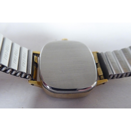 148 - A lady's Omega gold plated and stainless steel cased wristwatch, faced by a baton dial, on an expand... 