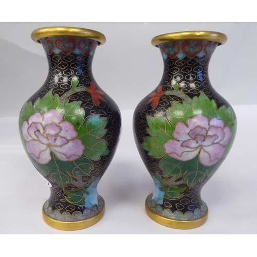 149 - A pair of 20thC cloisonné vases of waisted, baluster form, decorated with floral sprigs, on a... 