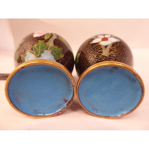 149 - A pair of 20thC cloisonné vases of waisted, baluster form, decorated with floral sprigs, on a... 