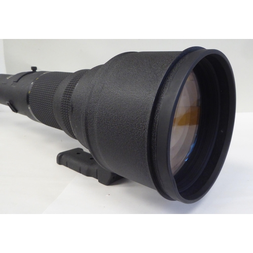 15 - A Nikon Nikkor 800mm 1:5.6 photographic lens, in a padded bag