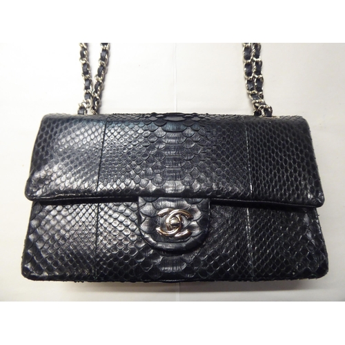 153 - A black snakeskin effect handbag