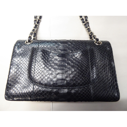 153 - A black snakeskin effect handbag