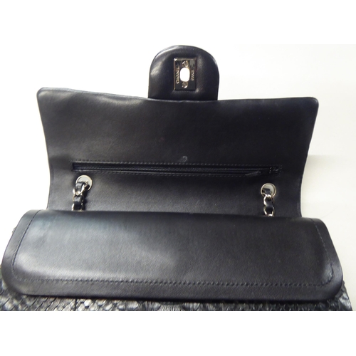 153 - A black snakeskin effect handbag