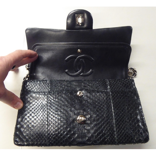 153 - A black snakeskin effect handbag