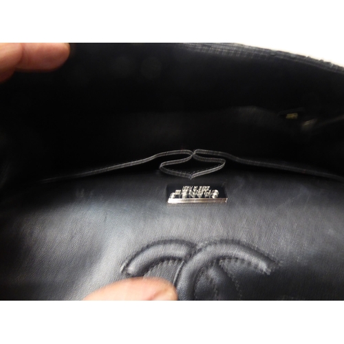 153 - A black snakeskin effect handbag