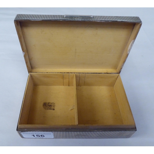 156 - A silver cigarette box with reeded ornament and a hinged lid, enclosing the cedar lined interior&nbs... 