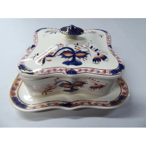 162 - Four dissimilar china table sardine boxes: to include one featuring a lobster handle, on scrolled fe... 