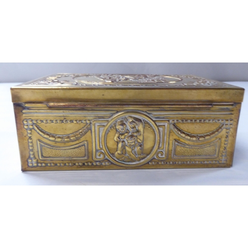 167 - A late 19thC cast gilded metal jewellery box, fashioned as a commode, the hinged lid enclosing a qui... 