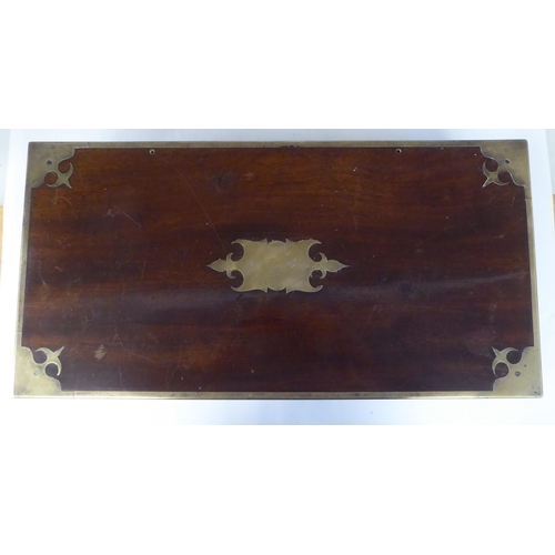 17 - A Victorian mahogany military style writing box with lacquered brass mounts and reinforcement, strai... 