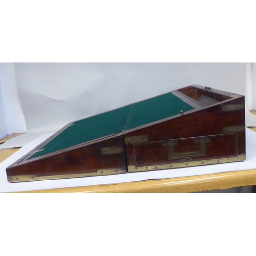 17 - A Victorian mahogany military style writing box with lacquered brass mounts and reinforcement, strai... 