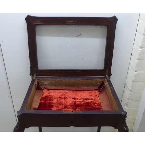 174 - An Edwardian brass inlaid mahogany display table with a glazed hinged lip, raised on cabriole legs&n... 