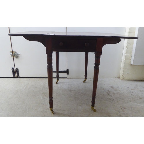 175 - A mid Victorian mahogany Pembroke table, raised on turned, tapered legs  29