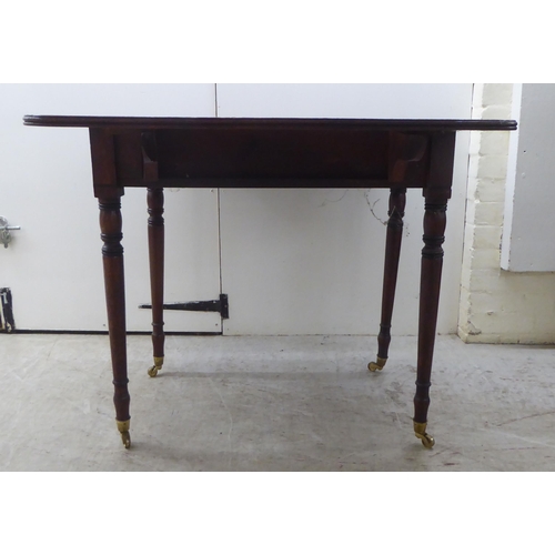 175 - A mid Victorian mahogany Pembroke table, raised on turned, tapered legs  29