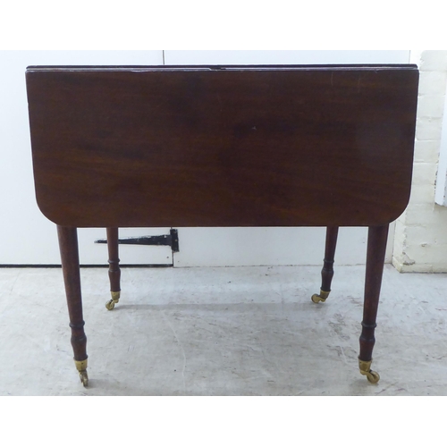 175 - A mid Victorian mahogany Pembroke table, raised on turned, tapered legs  29