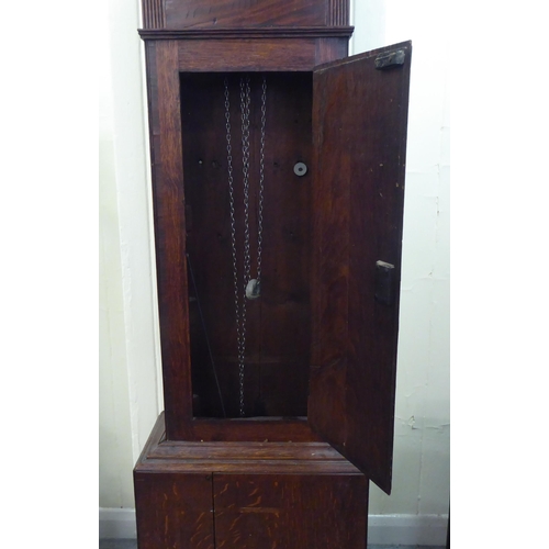 177 - An early 19thC oak longcase clock; the 20 hour movement faced by a painted Arabic dial, inscribed W.... 