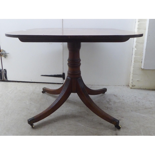 178 - A Regency mahogany single pedestal dining table, raised on splayed sabre legs and casters  28