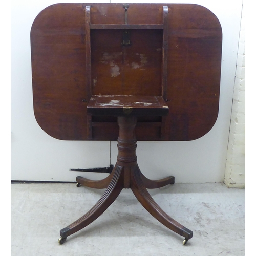 178 - A Regency mahogany single pedestal dining table, raised on splayed sabre legs and casters  28