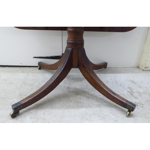 178 - A Regency mahogany single pedestal dining table, raised on splayed sabre legs and casters  28