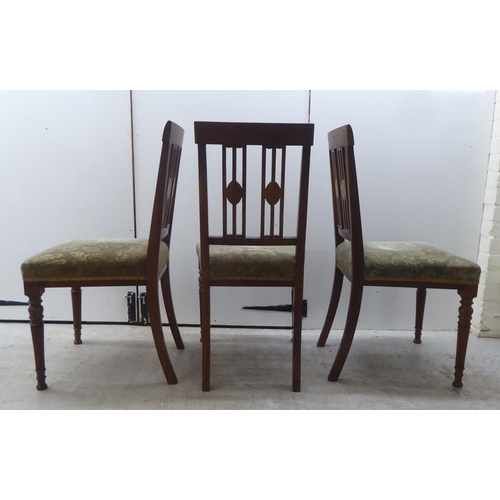 179 - A set of five Edwardian satinwood inlaid mahogany framed dining chairs, each with a splat-back and a... 