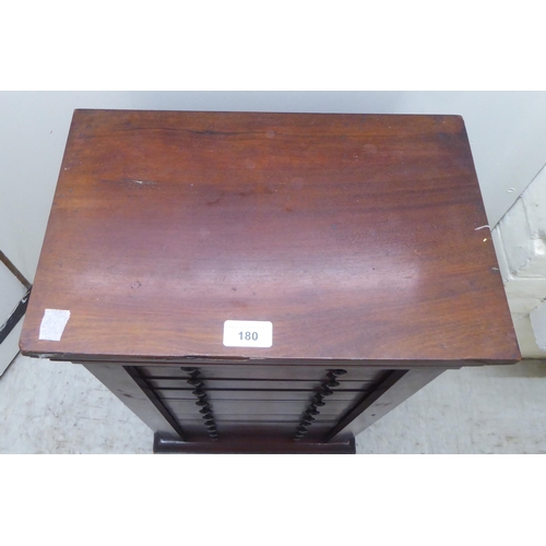 180 - An early Victorian diminutive mahogany  Wellington chest with ten drawers, on a plinth  28