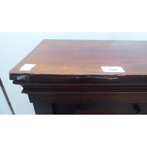 180 - An early Victorian diminutive mahogany  Wellington chest with ten drawers, on a plinth  28