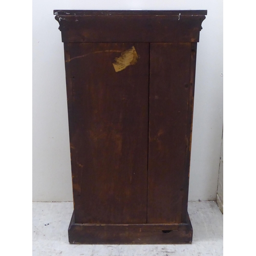 180 - An early Victorian diminutive mahogany  Wellington chest with ten drawers, on a plinth  28