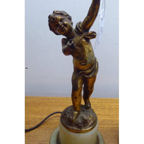 182 - Two mid 20thC gilt metal and onyx lamps, one shaped as a standing cherub  15