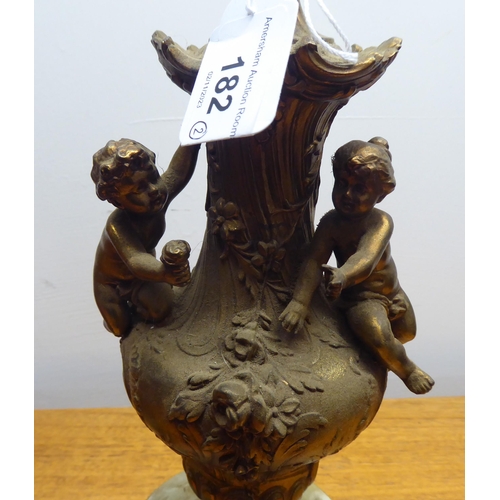 182 - Two mid 20thC gilt metal and onyx lamps, one shaped as a standing cherub  15