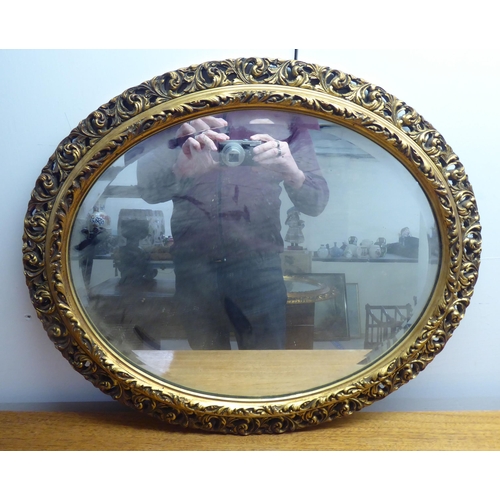 185 - Two similar mid 20thC mirrors, each in an ornate gilded plaster frame  largest 31