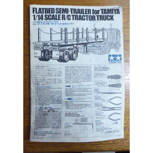 186 - A Tamiya 1:25 scale remote controlled model tractor tuck and trailer, decorated in green livery and ... 