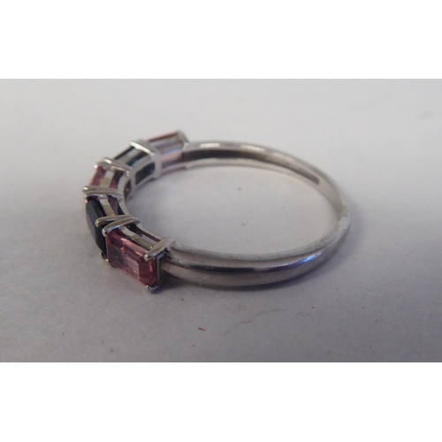 193 - A 9ct white gold ring, set with alternating pink and green tourmalines 