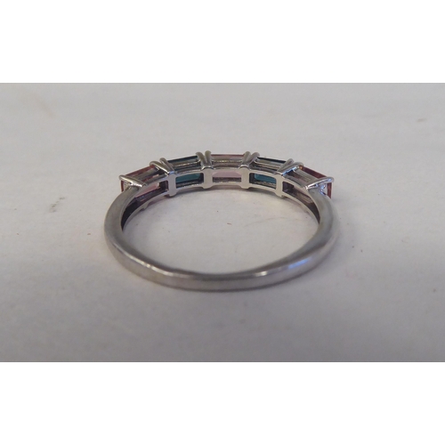 193 - A 9ct white gold ring, set with alternating pink and green tourmalines 