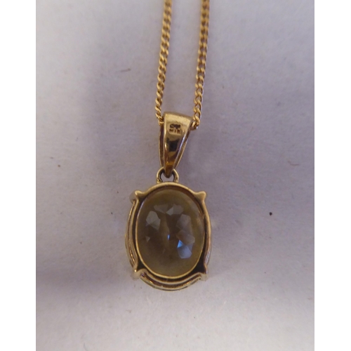 194 - A 9ct gold pendant, set with a lemon quartz, on a 9ct gold chain 