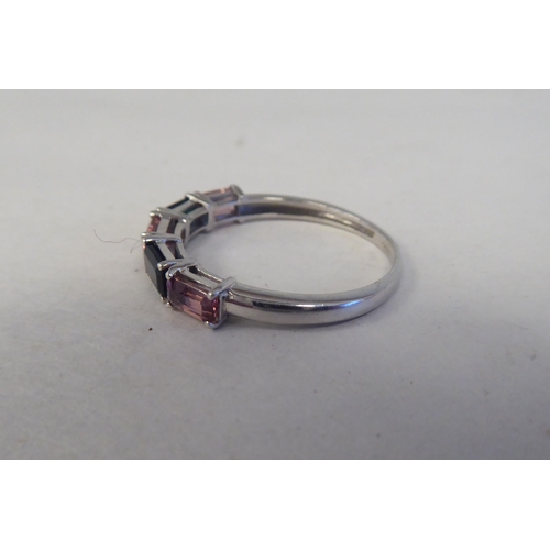 200 - A 9ct white gold ring, set with alternating pink and green tourmalines 