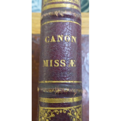 219 - Book, 'Canon Missae' in a red calf bound binding