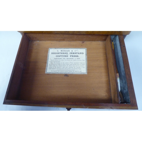 22 - A late 19thC S.Mordan & Co, London Registered Inkstand & Copying Press, including a stationa... 