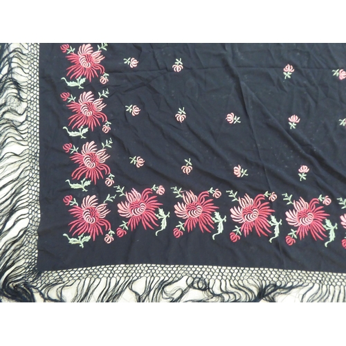 220 - An embroidered Black fabric piano shawl, decorated with flora  48