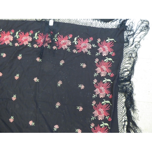 220 - An embroidered Black fabric piano shawl, decorated with flora  48