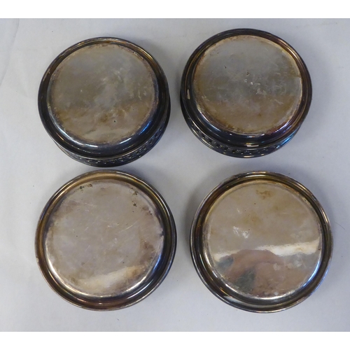 3 - A set of eight silver coloured metal coasters with decoratively pierced galleried sides  stampe... 