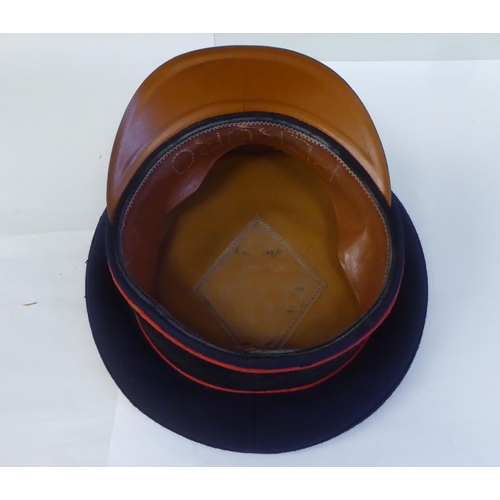 38 - A German military peaked cap with badge(Please Note: this lot is subject to the statement made in th... 