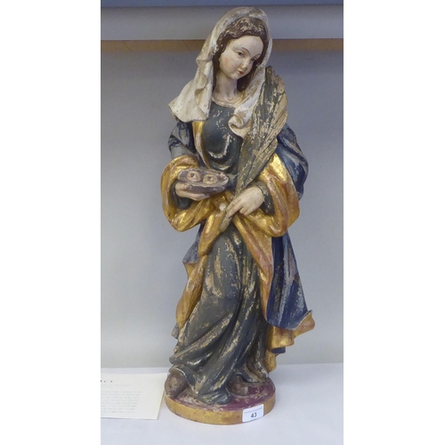 43 - A 19thC carved and painted wooden figure 'St Lucy Patron Saint of Sight and Sufferers of Eye Disease... 